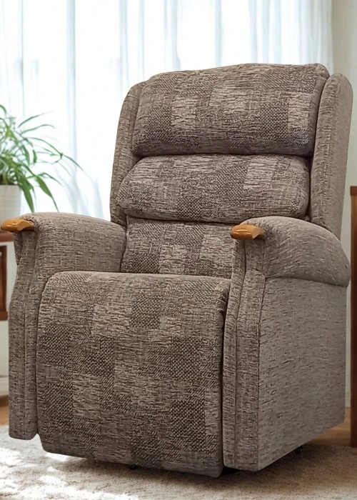 A patterned brown fabric rise and recline chair featuring wooden arm accents and a plush backrest.