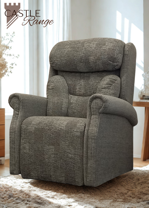 An electric rise and recline chair in a textured grey fabric with scroll arms and a supportive waterfall back, positioned in a bright room.