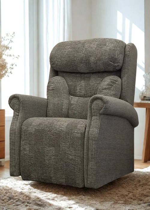 A grey patterned fabric rise and recline chair with a structured back and padded armrests, shown from the front.