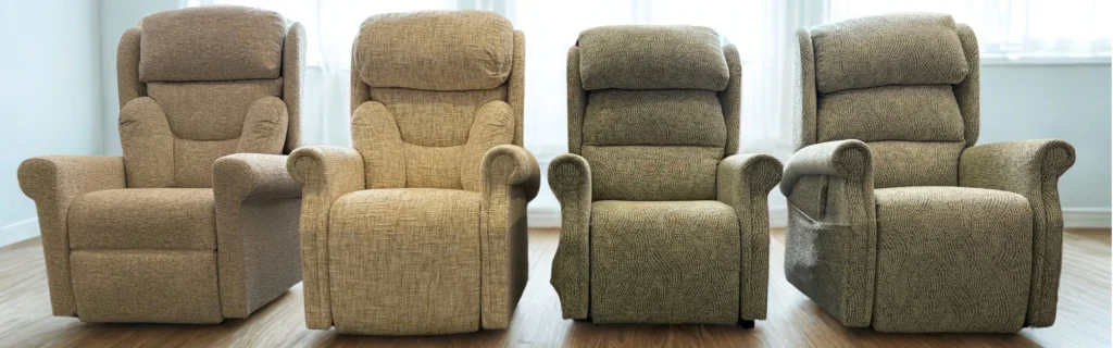 Four rise and recline chairs from The Castle Range, in various fabric patterns and colours, lined up in a bright room.
